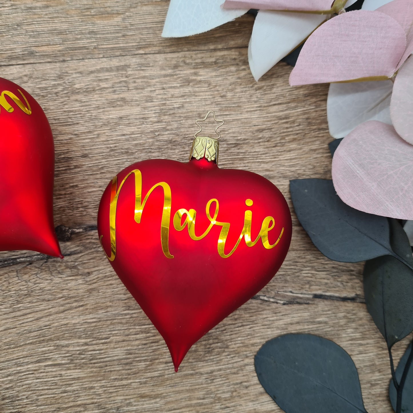 Set of 2 red heart-shaped glass Christmas balls with white text