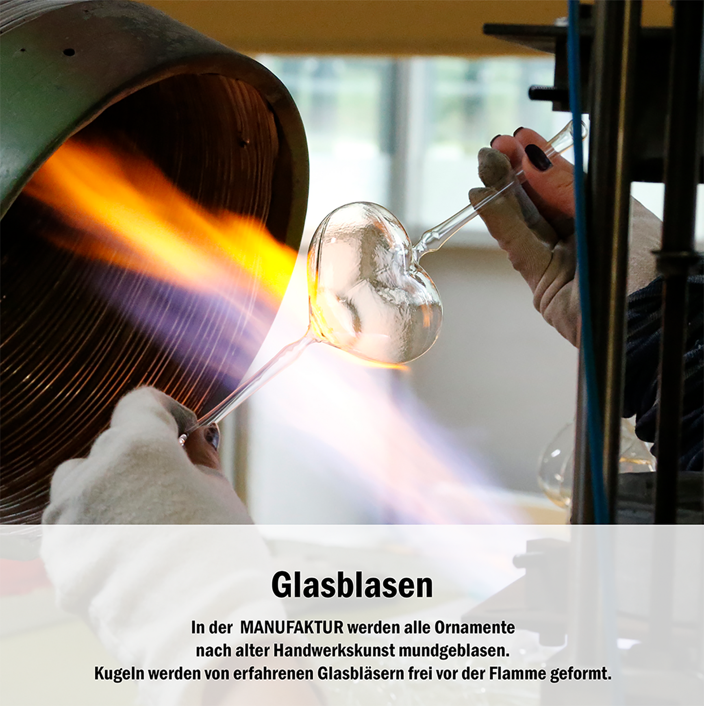 Red heart-shaped glass Christmas bauble with white text